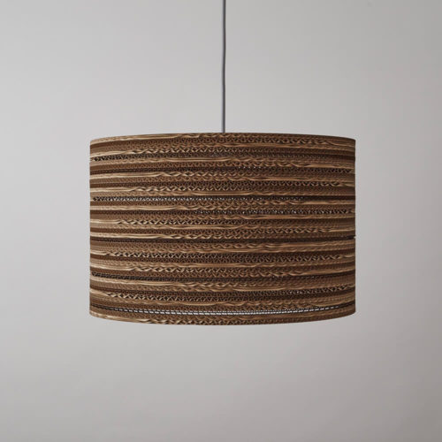 CartOn C1 eco lighting - corrugated cardboard - cylinder pendant, table or floor lamp Eco lighting, handmade in the UK entirely from cardboard. Using cardboard from FSC certified forests and made from 85% recycled material. Maximum wattage: 100w incandescent. Also compatible with CSL and LED lamps of equivalent wattage. The pattern in this cylinder shaped corrugated cardboard lamp shade casts an intricate pattern with a warm glow when lit. Non toxic, biodegradable glue and local materials. See all cardboard light shades at chalkandmoss.com/brand/tabithabargh