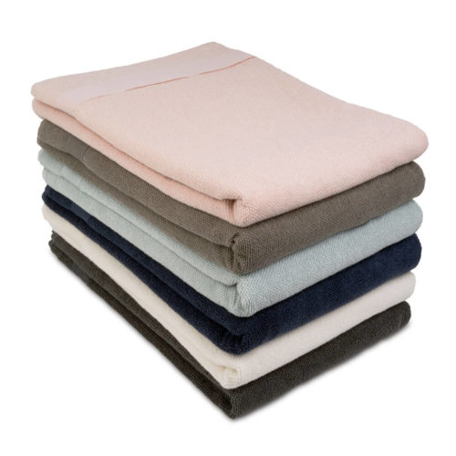 These organic terry weave large bath towels are designed to give you both comfort and functionality with their clever wrap style. Available in several colours, designed to mix and match. Use this large terry cotton wrap around towel as large bathroom towels, as beach towels or beach blankets, or as a gym towel. 160 x 75 cm, 100% ethically made GOTS certified organic cotton Weaving: Terry, grosgrain ribbon