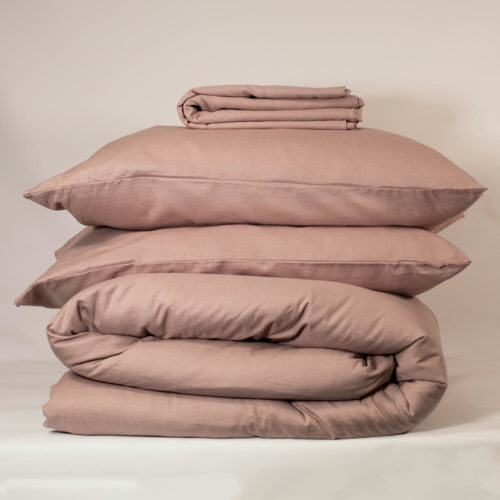 CHAMPAGNE PINK bedding set - organic linen & bamboo 2 pillowcases 1 duvet cover 1 flat sheet (optional, see note) Suitable for a Double bed or King size bed. The unique blend of organic flax linen and bamboo in this champagne pink bedding set makes Flax Sack bedding even softer and easier to look after without compromising on any of the usual linen qualities. Beautifully soft and natural, these bed linens are twice as durable as cotton and can last for decades. Bamboo prevents linen from creasing excessively and makes the fabric extremely easy to look after. The Flax Sack’s linen bedding is a sustainable choice that improves with age and becomes softer with each wash. Naturally antibacterial, hypoallergenic and moisture absorbent, Flax Sack sustainable bed linens are also kind to the skin due to the fabric’s neutral pH level and its ability to help regulate the body temperature of its users. Both linen and bamboo are advisable for even the most sensitive and eczema prone skin, becoming the perfect solution to ensure a good night’s sleep. Every effort has been made to make this bedding affordable compared to much linen bedding on the market, and this set brings the price to you down even more! Features: Soft Crease resistant Twice as durable as cotton Sustainable Hypoallergenic Antibacterial Moisture absorbent Becomes softer with each wash Material: 85% linen / 15% bamboo Care: Do not bleach; wash 30 degrees; iron high Pink duvet set dimensions Double bedding set: Pillow case - 50cm x 75cm Duvet cover - 200cm x 200cm Flat sheet - 230cm x 270cm King bedding set: Pillow case - 50cm x 75cm Duvet cover - 225cm x 225cm Flat sheet - 275cm x 275cm (optional, see note) The linen bedding set is available with or without the flat sheet (separate product listings). Flax Sack bed linen and table linen is available in champagne pink, dark olive and oyster white.