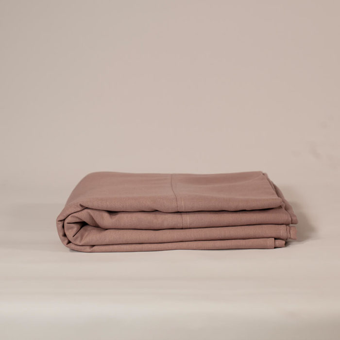 Linen flat sheet in oyster white, olive grey or champagne pink (seen here in champagne pink) The unique blend of organic linen and bamboo makes this linen flat sheet soft and easy to care for, without compromise. Affordable, wonderfully soft and natural, these organic bed linens are twice as durable as cotton and can last for decades with the right care. Bamboo minimises creasing in linen and makes the fabric really easy to look after. The Flax Sack’s bedding is a responsible choice, where the fabric improves with age and becomes softer with each wash. Quite simply, a sustainable choice in bedding. Sleeping in linen bedding has a unique weighted and textured quality, that's quite different to other bedding. Naturally antibacterial, hypoallergenic and moisture absorbent, these organic linen flat sheets are also kind to the skin due to the fabric’s neutral pH level and its ability to help regulate body temperature. Linen and bamboo suit sensitive and eczema prone skin, ensuring everyone a good night’s sleep. Why not surround your body with linen bedding, with the flat sheet, duvet cover and pillowcases in the Flax Sack bedding set. Available in three colours. Soft Crease resistant Twice as durable as cotton Sustainable Hypoallergenic Antibacterial Moisture absorbent Becomes softer with each wash Material: 85% flax linen / 15% bamboo Dimensions: Double: 230cm x 270cm King: 275cm x 275cm Choose from natural Oyster White, Olive Grey or Champagne Pink duvet covers, pillowcases or flat sheets to match or complement your decor. The Olive Grey borders on a deep green colour for a luxurious feel. All Flax Sack bedding is available in these colours and a choice of adult and children's bedding sizes (children's bedding comes in only white).