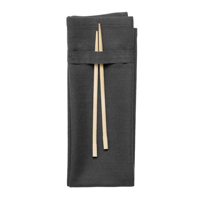 Organic napkins in many colours, shown here in dark grey. Defying seasonal trends, these cotton napkins are designed for long term use. They have a handy loop for hanging or attaching chopsticks or other table decor. Sustainable Scandinavian kitchen textiles and homewares. Designed in Copenhagen, Denmark. 40x50cm