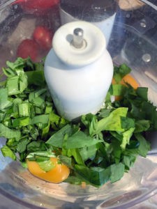 To make wild garlic pasta dough, start by blending the washed and dried wild garlic leaves and eggs in a blender, then add the flour.