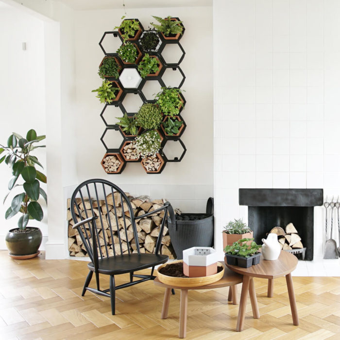 This vertical planter makes a statement in your natural interior, for a welcoming and restorative atmosphere. Achieve a botanical style that's long lasting and easy to care for. An ideal interior living wall kit consisting of just the right number of terracotta planters and frames for your space. There are several kits to choose from, and you can buy separates to grow your garden further. This modular living wall system lets you customise the look, with a choice of kits to suit the space and style of your room (S-XL). There's so much potential to design your perfect layout! Water your vertical horticulture garden from the top of each terracotta planter, through the specially designed holes. The slope to prevents overflowing. The natural terracotta planters and frames are made to be visible, with a beautiful design, texture and quality. The frames are stylishly made from powder coated steel. Reconnect your home interior with nature with a vertical living wall; your mind and body will thank you for it. Bringing nature into our home for wellness called biophilic interiors. Create a vertical living wall statement piece, an urban jungle bathroom, vertical garden kitchen or a relaxing oasis in a bedroom. Add some air purifying and calming plants in your vertical planter, like lavender and peace lilies, creating your dream nature inspired home decor. The terracotta plant pots also make lovely display units in themselves, so why not pop trinkets or kindling in them? These beautiful terracotta planters and frames are made in the UK with passion, expertise and precision.