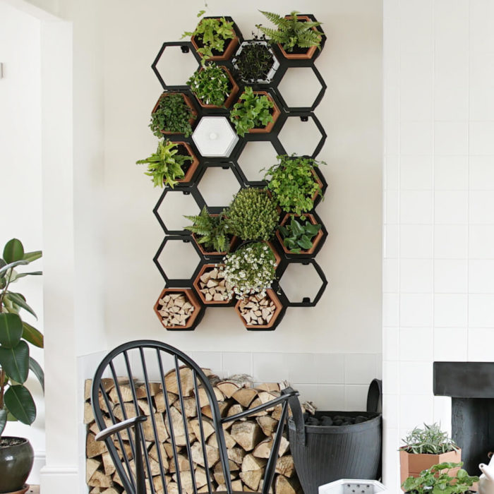 This vertical planter makes a statement in your natural interior, for a welcoming and restorative atmosphere. Achieve a botanical style that's long lasting and easy to care for. An ideal interior living wall kit consisting of just the right number of terracotta planters and frames for your space. There are several kits to choose from, and you can buy separates to grow your garden further. This modular living wall system lets you customise the look, with a choice of kits to suit the space and style of your room (S-XL). There's so much potential to design your perfect layout! Water your vertical horticulture garden from the top of each terracotta planter, through the specially designed holes. The slope to prevents overflowing. The natural terracotta planters and frames are made to be visible, with a beautiful design, texture and quality. The frames are stylishly made from powder coated steel. Reconnect your home interior with nature with a vertical living wall; your mind and body will thank you for it. Bringing nature into our home for wellness called biophilic interiors. Create a vertical living wall statement piece, an urban jungle bathroom, vertical garden kitchen or a relaxing oasis in a bedroom. Add some air purifying and calming plants in your vertical planter, like lavender and peace lilies, creating your dream nature inspired home decor. The terracotta plant pots also make lovely display units in themselves, so why not pop trinkets or kindling in them? These beautiful terracotta planters and frames are made in the UK with passion, expertise and precision.