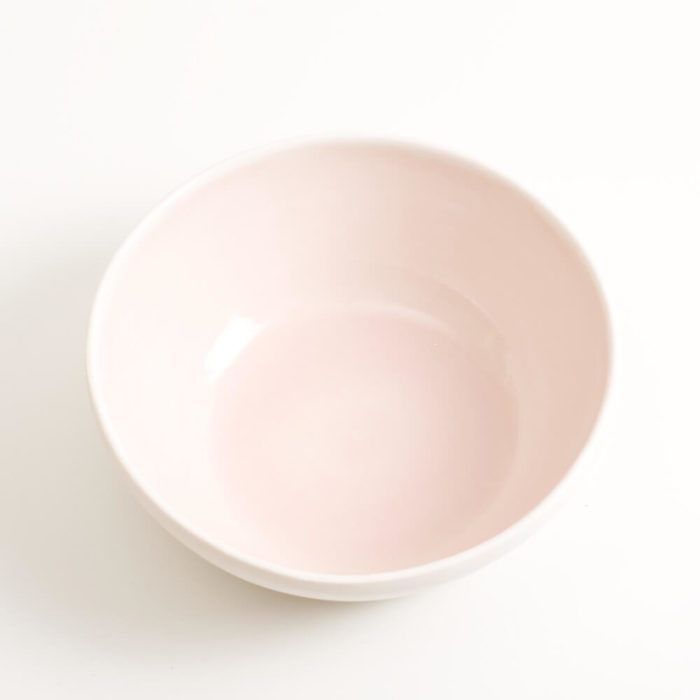 Handmade shallow porcelain bowl in pink. Hand-thrown with natural ridges and pale coloured pastel inside. Perfect for cereal or soup. Beautiful on its own or as part of a mix and match set. Available in 4 colours: Pink, blue, turquoise and grey.