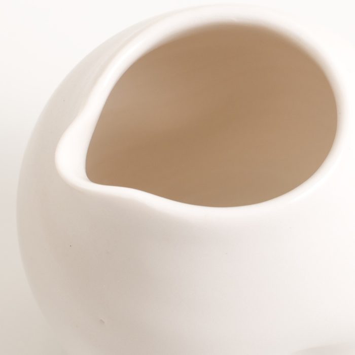 Handmade porcelain dimpled jug white. With a matt white glaze on the outside and soft coloured inside. Available in white, grey and turquoise, in two sizes. Perfectly formed dimples to fit in your hand. Handmade by Linda Bloomfield in London. Sold on chalkandmoss.com.