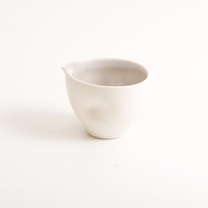 Handmade porcelain condiments bowl ideal for sauces, mayonnaise or hummus. Small or medium size with tactile dimples instead of handles. Inside glazed in pale blue, turquoise, pink or grey.