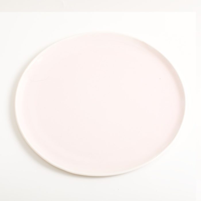 Handmade medium pink porcelain plate. Made in 3 sizes 5 colours. Hand thrown in England, dishwasher safe. These look great as part of a mix and match set. For every day dining and entertaining.