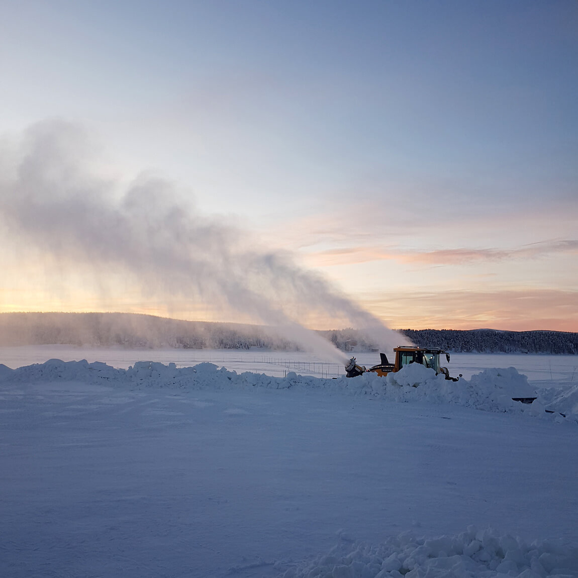 Snow canons at sunset at ICEHOTEL Sweden, helping make the right kind of snow for the construction of ICEHOTEL