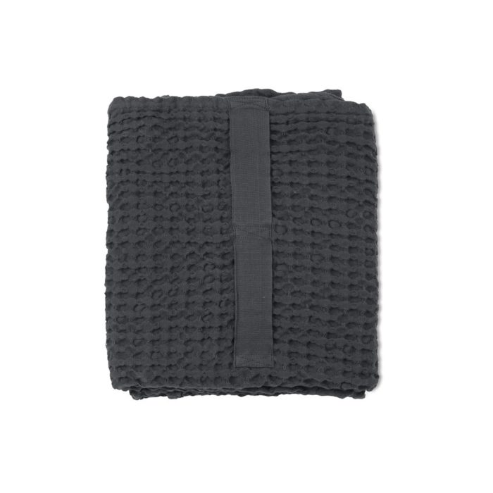 Waffle towels designed by The Organic Company. This soft and absorbent medium sized towel is available in a range of soft colours with a Scandinavian feel. Seen here in dark grey.