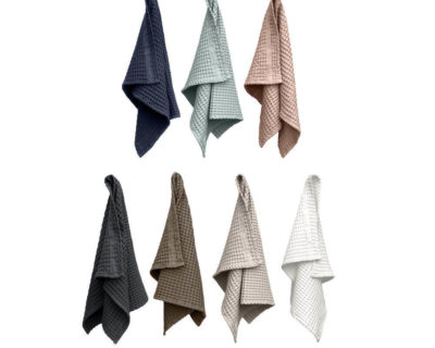 This hand towel by Denmark's The Organic Company is soft and absorbent, making it ideal in bathrooms, guest rooms and the kitchen. The giant waffle texture gives the towel a luxurious and comforting quality. In true Scandinavian style, these ethical towels come in several complimentary colours that look great stacked together (dark grey, white, dark blue, sky blue, clay, pale rose). There's a handy loop for hanging. A practical size at 75 x 50cm. Made from sustainable 100% GOTS certified organic cotton in India.