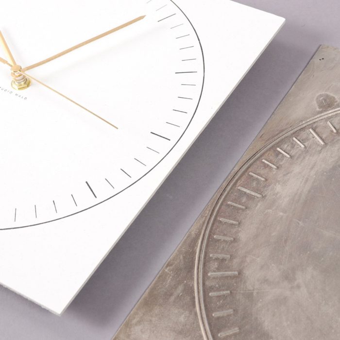 Paper clock in recycled paper, with a sturdy back. By Wald, sold on Chalk & Moss (chalkandmoss.com).