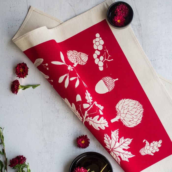 Cotton napkins in a winter botanical leaf print - 4 vibrant colours available, here shown in poppy red. Designed by Softer + Wild, hand screen printed in Sussex, UK. Sold on Chalk & Moss (chalkandmoss.com).