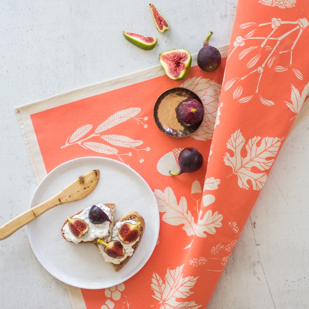 Winter leaves on this peach coloured tea towel, by Softer + Wild. Available on chalkandmoss.com.