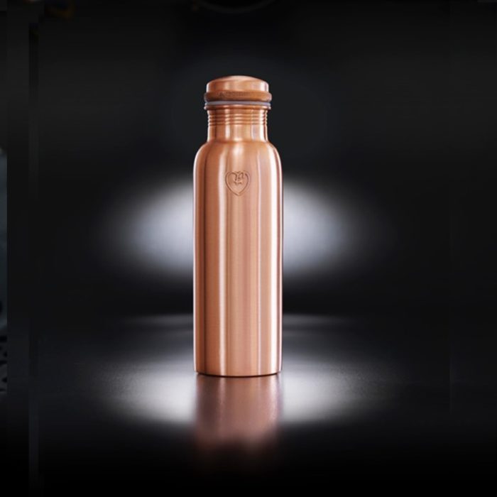 Copper metal water bottle in a smooth matte texture. The "Athlete" bottle has an extra wide mouth so you can drink easily and pop ice cubs inside. The pure copper naturally charges to water with antioxidant, anti-inflammatory and anti-microbial properties. This helps ease digestive and joint ailments, improves red blood cells, helps regenerate skin cells and more! Also available in hammered texture, all on Chalk & Moss (chalkandmoss.com).