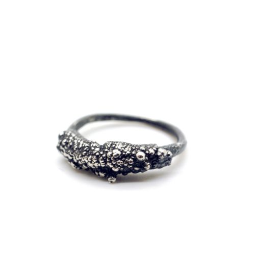 Chunky silver ring (Style 3) made by electroforming, with knobbly formations created by electrical currents in the making process. Heavy texture on the top half of the ring define the Style 3 ring. Made from 925 silver.