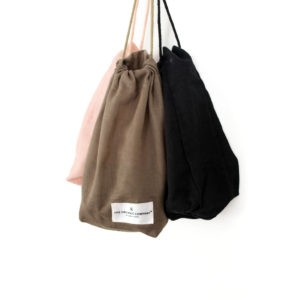 All purpose cotton drawstring bag available in clay, pale rose and black, size small, medium and large. Sustainably made by Denmark's The Organic Company, your gateway to zero waste living on chalkandmoss.com!