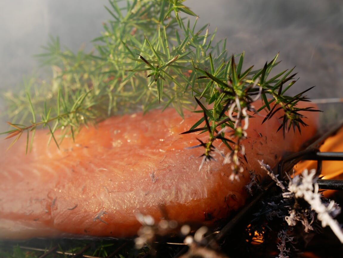 Hot smoked salmon with juniper. Looking for salmon recipes? I highly recommend this one. The salmon is hot smoked directly onto flames and juniper bushes. The ash creates a beautiful smoky flavour. I followed the recipe from Niklas Ekstedt in Food from the Fire.