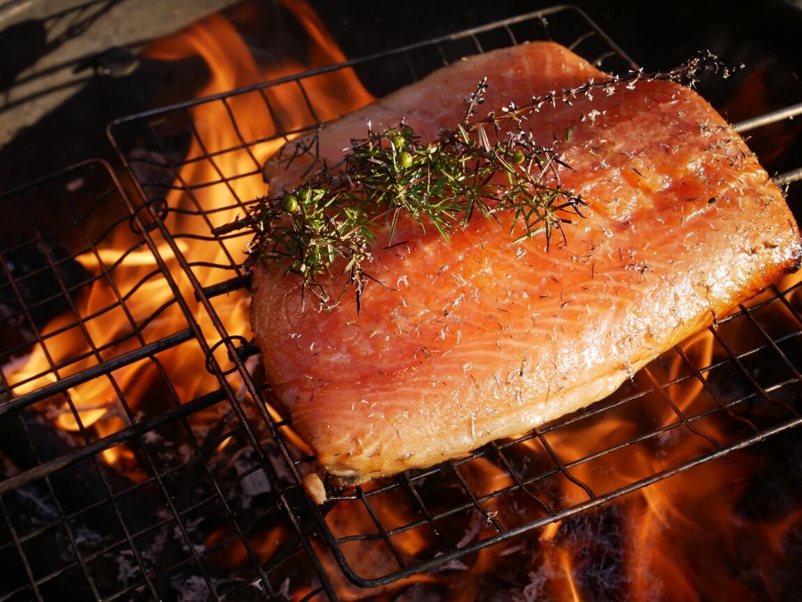 Hot smoked salmon with juniper. Looking for salmon recipes? I highly recommend this one. The salmon is hot smoked directly onto flames and juniper bushes. The ash creates a beautiful smoky flavour. I followed the recipe from Niklas Ekstedt in Food from the Fire.