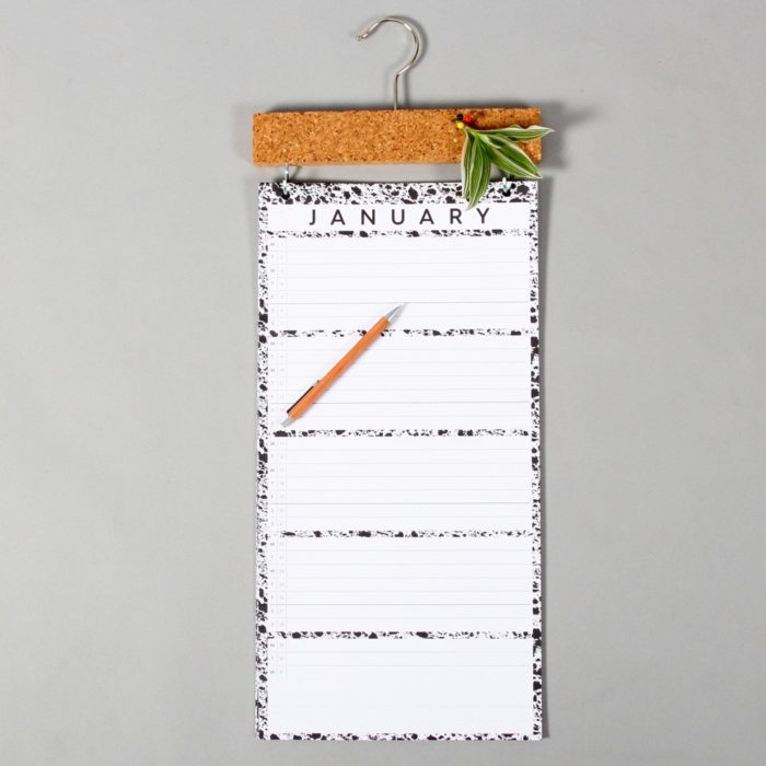 Large wall calendar with a month to view and a practical cork strip for pinning important notes. Get your family organised with this simple monochrome design. W23 x H57 x D2 cm