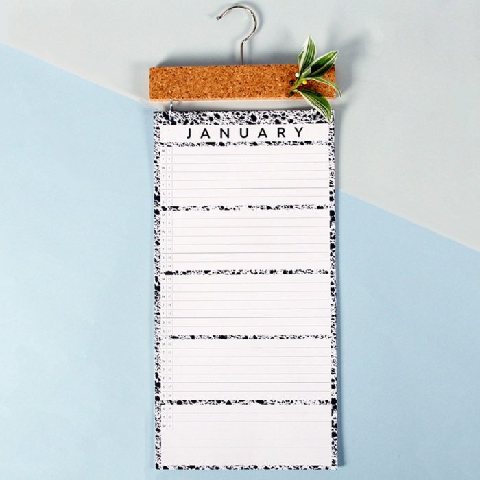 Large wall calendar with a month to view and a practical cork strip for pinning important notes. Get your family organised with this simple large monochrome wall year planner design. W23 x H57 x D2 cm