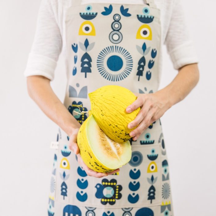 Cooking apron combining Scandinavian shapes and colours with Eastern European folklore. Inspired by retro Christmas tree baubles. Available in two colours. This is the "Solstice" design. 60cm X 80cm.