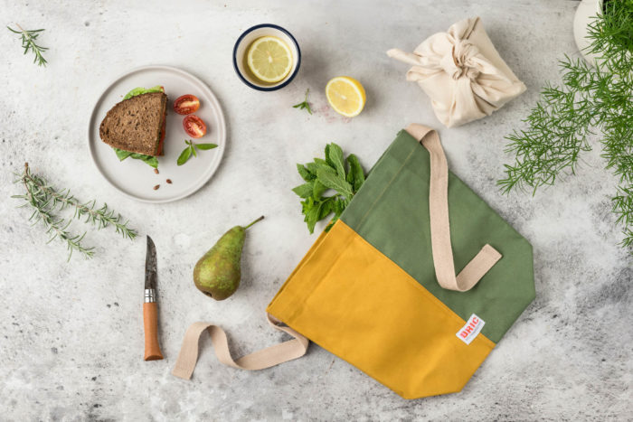 Eco friendly lunch bag - cotton canvas lunch containers with a washable lining. Front pocket & carry strap.